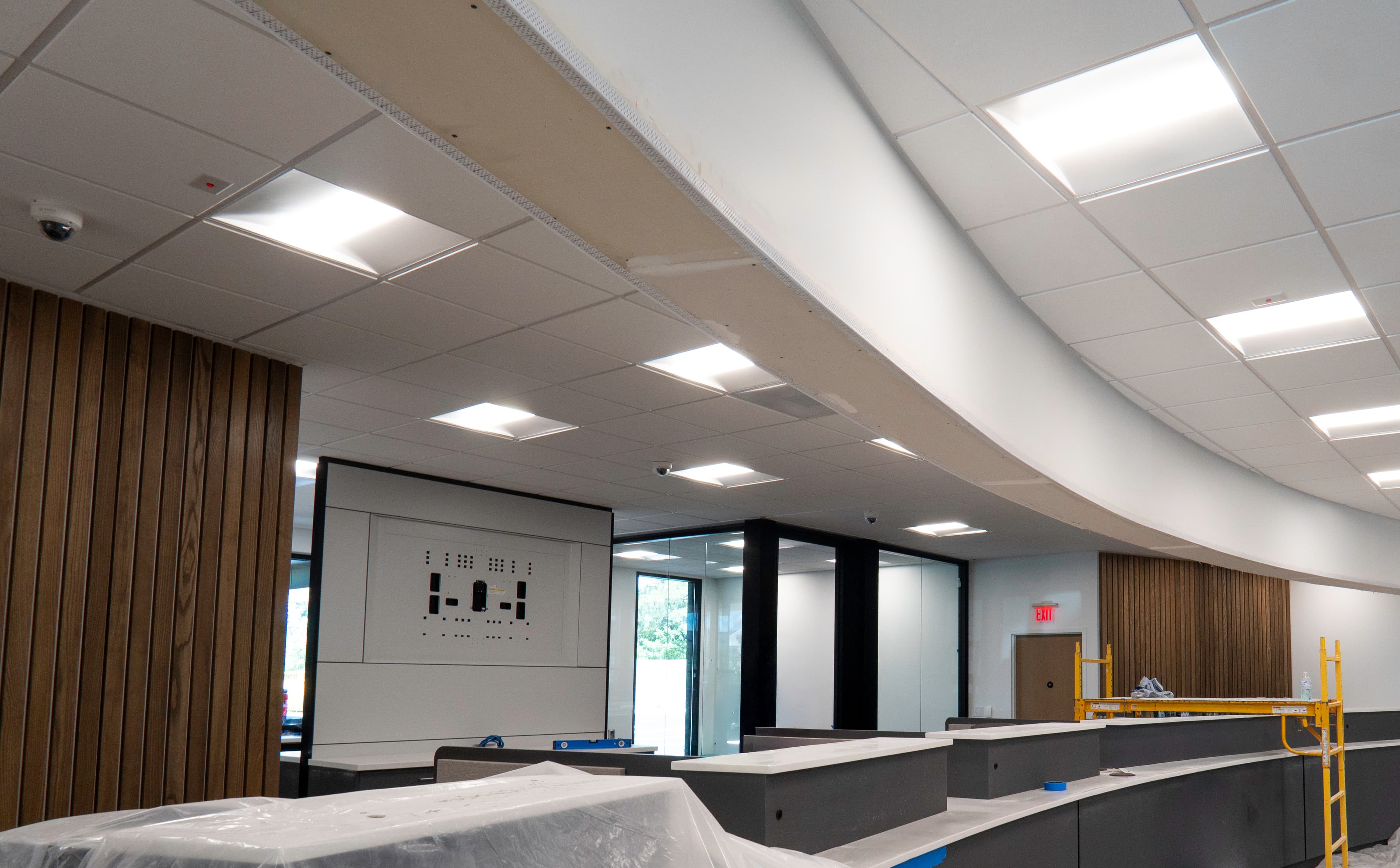 Finished credit union interior with curved acoustical ceiling